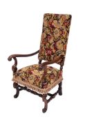 A William and Mary walnut open armchair, the highback and stuff over seat in tapestry fabric,