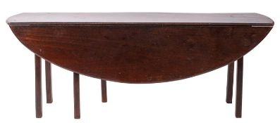 A stained hardwood dropleaf wake table in 19th Century style; with oval top and straight gate legs;