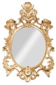 A Contemporary carved giltwood oval mirror, in 18th century style,