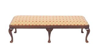 A carved beechwood fender stool in the Georgian taste,