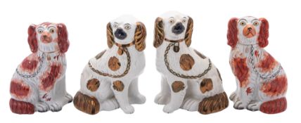 Two pairs of Staffordshire pottery comforter spaniels