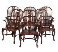 A set of six walnut, ash and beech wood stick back Windsor elbow chairs,