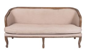 A French limed beechwood show frame sofa in Louis XV style,
