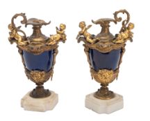 A pair of Rococo Revival blue porcelain and gilt bronze mounted urn candleholders in Louis XV taste,
