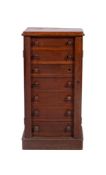 A Victorian oak Wellington chest, containing seven drawers, enclosed by a pilaster locking stile,