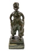 A Dutch patinated bronze model of a boy, early 20th century; portrayed standing in rustic attire,