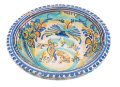 A Spanish tin-glazed pottery lebrillo bowl, Triana [Seville]19th century painted in blue, ochre,