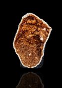 A large smoky quartz (amber-brown) half geode,