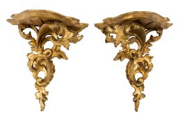 A pair of carved and giltwood wall brackets in Rococo style,