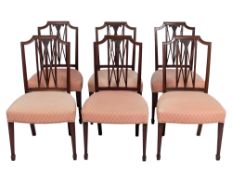 A set of six late 19th century carved mahogany dining chairs,