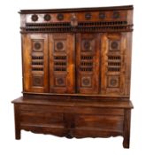 An early 19th Century Breton fruitwood and pine side cupboard,