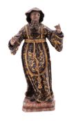 An Italian carved, painted and parcel giltwood model of a saint, probably Saint Francis,