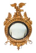 A Regency carved giltwood and gesso circular convex girandole mirror,