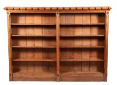An Aesthetic movement pitch pine open bookcase, with castellated top,