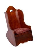 A Child's early 19th century fruitwood rocking chair, the wing back with domed top rail,