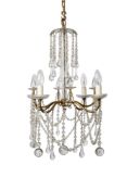 A gilt metal and cut and moulded glass hung six light chandelier, in Regency style,