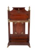 By James Shoolbred and Co - An aesthetic movement walnut and brass mounted stick stand with shelf,