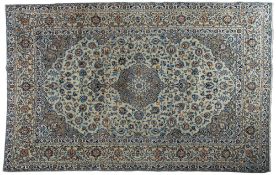 A Kashan carpet, the pastel blue cartouche field with a central cartouche pole medallion,