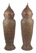 A pair of substantial Middle Eastern repousse and pierced copper urn floor lamps,
