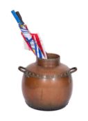 A copper and brass mounted jar in Arts & Crafts style, probably an umbrella stand,