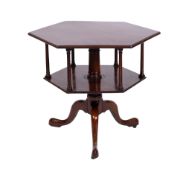 A mid 18th century mahogany hexagonal revolving book table, having a moulded top,