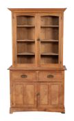 A pine kitchen dresser, the upper part with a moulded cornice,