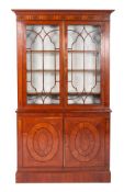 An early 19th century satinwood and marquetry bookcase,
