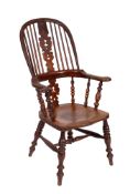 A Victorian elm and yew wood stick back Windsor elbow chair,