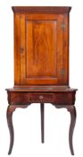 A late 19th century mahogany and inlaid corner cupboard on an associated stand,
