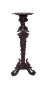 A late 19th Century Italianate carved pine cherub torchere,