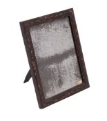 An 18th century black lacquer and gilt chinoiserie easel toilet mirror with a contemporary plate,