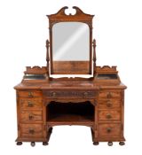 A Victorian pollard oak and carved breakfront dressing table,