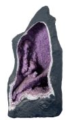 A large rock crystal (amethyst quartz) geode section,