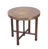An Indian brass circular Tiffin table, on a folding wood stand, the top with geometric decoration,