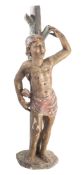 A Continental provincial painted stone model of Saint Sebastien,