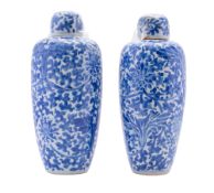A pair of Chinese blue and white vases and covers,