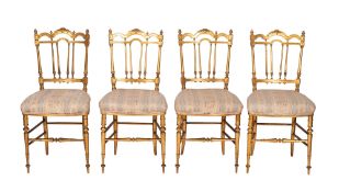A set of four French giltwood salon chairs,