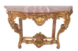 A 19th century French carved giltwood serpentine fronted console table,