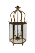A gilt brass and glass hexagonal hall lantern, in Regency taste,