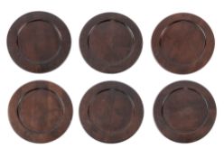 A set of six dark stained oak trenchers,