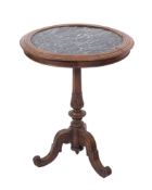 A 19th century carved walnut and marble topped circular occasional table,