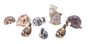 Eight Royal Crown Derby porcelain paperweights,