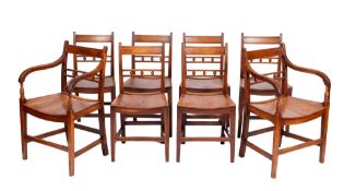 A set of eight Regency elm and fruitwood dining chairs,