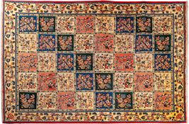 A Sarouk carpet, the compartmented field in ivory, rose,