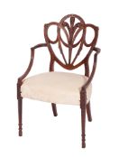 An early 19th century carved satinwood elbow chair,