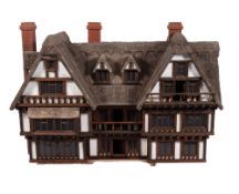 A large stained wood and composition dolls' house, by Robert Stubbs,