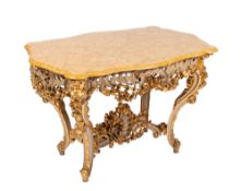 An Italian carved cream and gilt wood decorated Centre Table of serpentine outline,