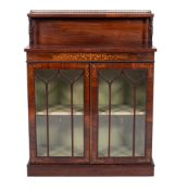 An early 19th century rosewood and inlaid chiffonier,