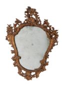 A late 18th/early 19th century Continental carved giltwood cartouche shaped mirror, possibly Swiss,