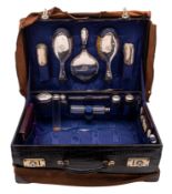 An early 20th century black crocodile leather dressing case